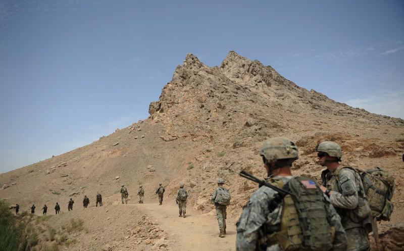 Sgt. Adam Lachance (C) from Rochester, NH and Specialist Taylor (R) from Lakes Wales, FL follow a column of members of the 2nd BTC, 101st Airborne Division.